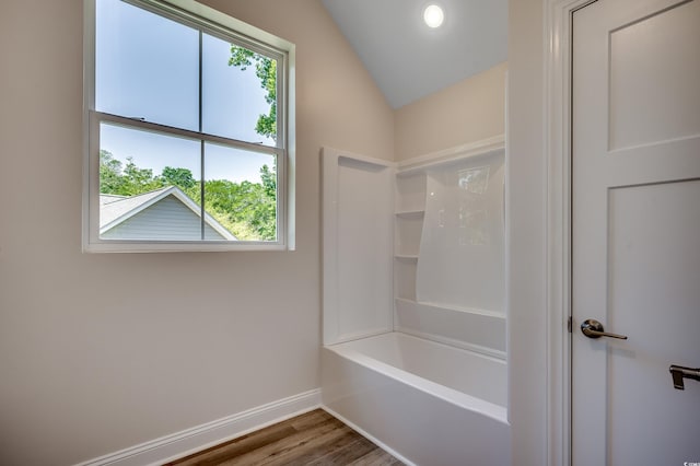 1673 Carriage Ln, Little River, SC 29566 - full bath with vaulted ceiling, wood finished floors, and shower / bathtub combination