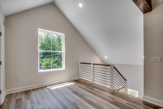 1673 Carriage Ln, Little River, SC 29566 - unfurnished living room featuring vaulted ceiling, wood finished floors, recessed lighting, and baseboards