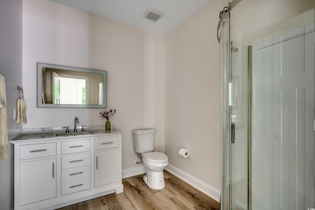 1673 Carriage Ln, Little River, SC 29566 - bathroom with toilet, wood finished floors, a stall shower, and vanity