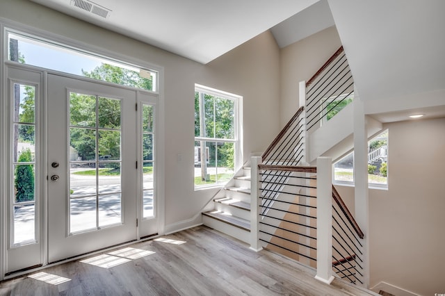 1673 Carriage Ln, Little River, SC 29566 - doorway to outside featuring wood finished floors and stairs