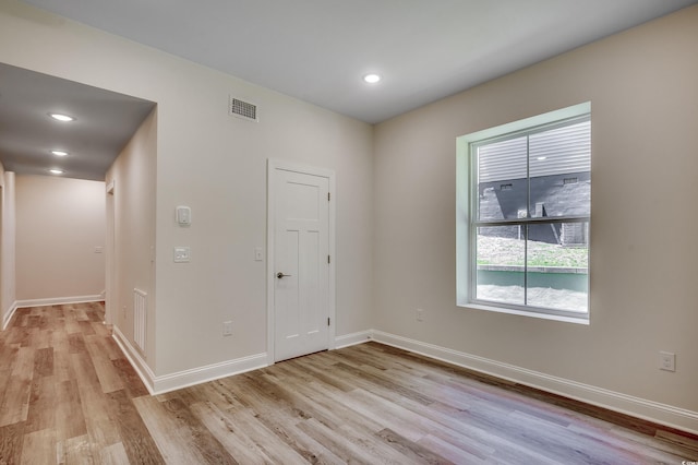 1673 Carriage Ln, Little River, SC 29566 - empty room featuring light wood-style flooring, baseboards, and recessed lighting
