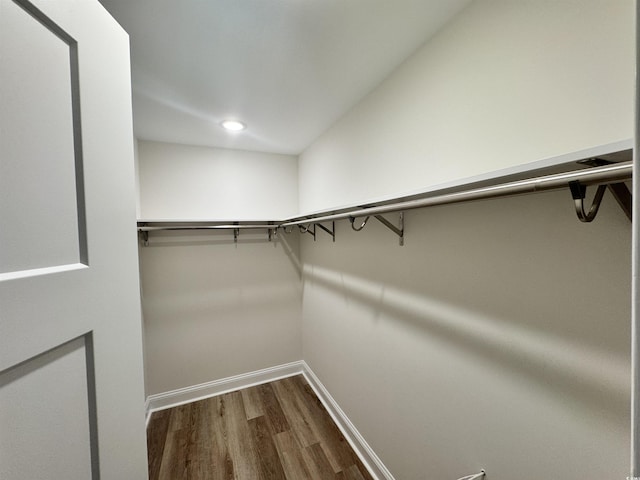 1673 Carriage Ln, Little River, SC 29566 - walk in closet featuring dark wood-type flooring