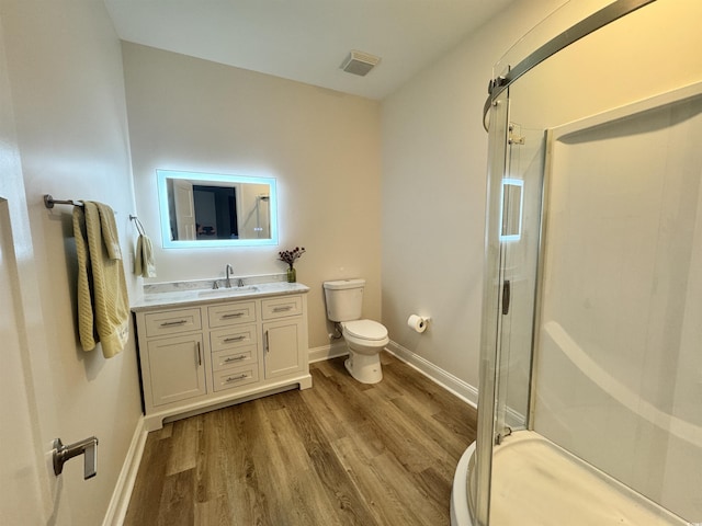1673 Carriage Ln, Little River, SC 29566 - bathroom featuring a stall shower, wood finished floors, and vanity