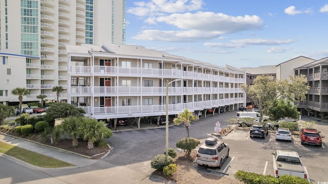 210 N Ocean Blvd Unit 333, North Myrtle Beach, SC 29582 - view of apartment building / complex with uncovered parking