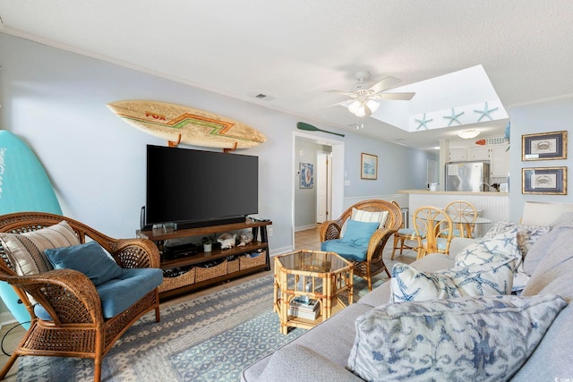 210 N Ocean Blvd Unit 333, North Myrtle Beach, SC 29582 - living area featuring ornamental molding, ceiling fan, and a textured ceiling