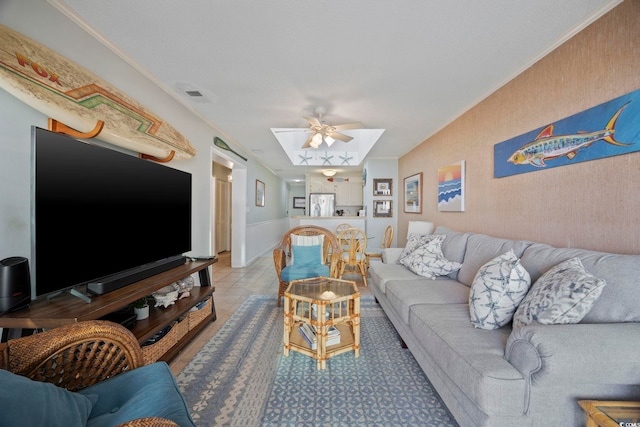 210 N Ocean Blvd Unit 333, North Myrtle Beach, SC 29582 - living room featuring ceiling fan, a skylight, and crown molding