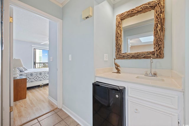 210 N Ocean Blvd Unit 333, North Myrtle Beach, SC 29582 - bathroom featuring vanity, crown molding, ensuite bath, and tile patterned flooring