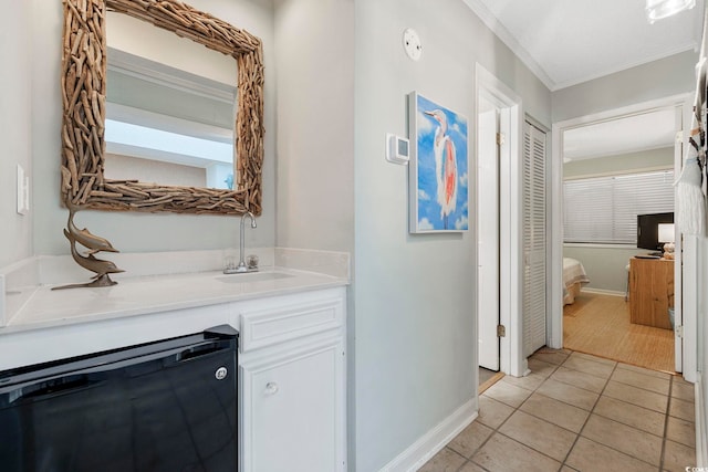 210 N Ocean Blvd Unit 333, North Myrtle Beach, SC 29582 - bathroom with vanity, ornamental molding, and tile patterned floors