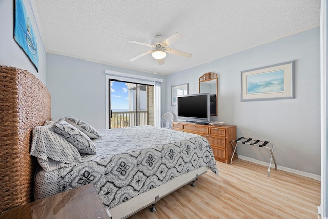 210 N Ocean Blvd Unit 333, North Myrtle Beach, SC 29582 - bedroom with a textured ceiling, light wood-style flooring, access to outside, a ceiling fan, and ornamental molding