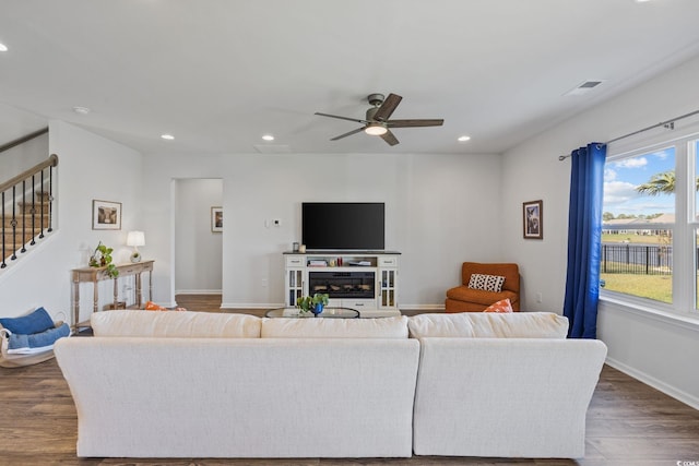 4410 Honir Dr, Myrtle Beach, SC 29579 - living area featuring dark wood-style flooring, recessed lighting, healthy amount of natural light, a ceiling fan, and stairway