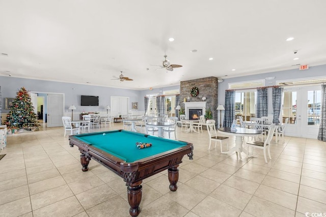 4410 Honir Dr, Myrtle Beach, SC 29579 - game room with french doors, a large fireplace, healthy amount of natural light, and recessed lighting