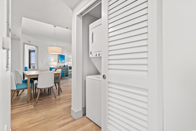 3000 N Ocean Blvd N Unit 1401, Myrtle Beach, SC 29577 - laundry area featuring stacked washer / dryer and light wood-style floors