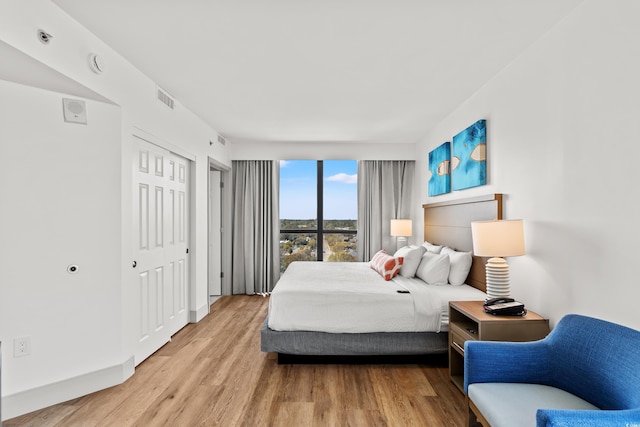 3000 N Ocean Blvd N Unit 1401, Myrtle Beach, SC 29577 - bedroom featuring wood finished floors and baseboards