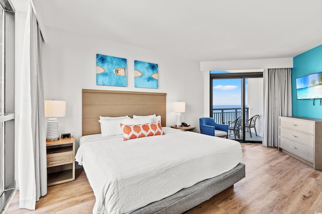 3000 N Ocean Blvd N Unit 1401, Myrtle Beach, SC 29577 - bedroom with access to exterior and light wood-style flooring