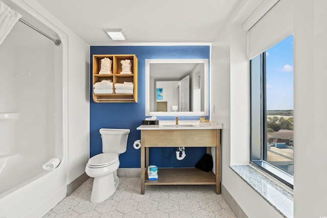 3000 N Ocean Blvd N Unit 1401, Myrtle Beach, SC 29577 - full bathroom featuring toilet, vanity, baseboards, and tile patterned flooring