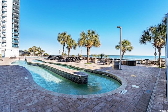 3000 N Ocean Blvd N Unit 1401, Myrtle Beach, SC 29577 - community pool featuring a jacuzzi and a patio area