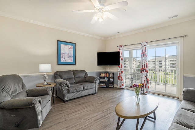 4895 Luster Leaf Cir Unit 302, Myrtle Beach, SC 29577 - living area with wood finished floors, crown molding, ceiling fan, and baseboards