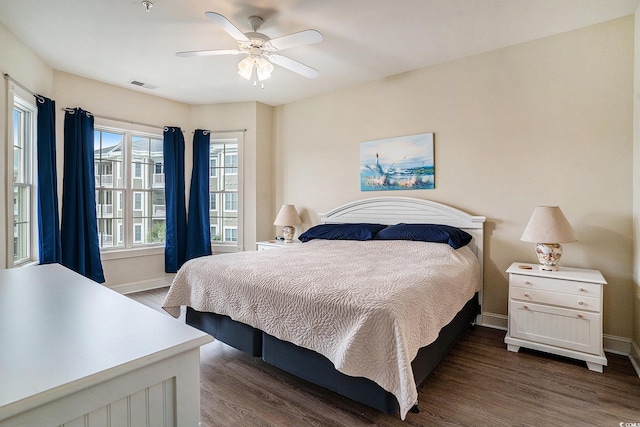 4895 Luster Leaf Cir Unit 302, Myrtle Beach, SC 29577 - bedroom featuring dark wood-style floors, baseboards, and ceiling fan