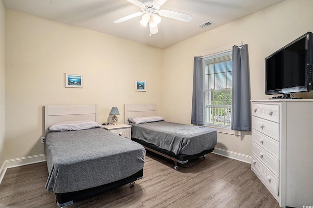 4895 Luster Leaf Cir Unit 302, Myrtle Beach, SC 29577 - bedroom featuring wood finished floors, baseboards, and a ceiling fan