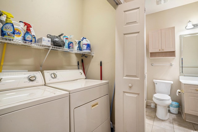 4895 Luster Leaf Cir Unit 302, Myrtle Beach, SC 29577 - laundry area featuring light tile patterned floors and washer and clothes dryer