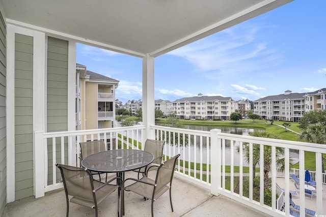 4895 Luster Leaf Cir Unit 302, Myrtle Beach, SC 29577 - balcony featuring a water view, outdoor dining space, and a residential view