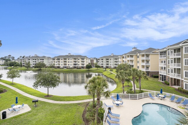 4895 Luster Leaf Cir Unit 302, Myrtle Beach, SC 29577 - community pool with a water view and a patio