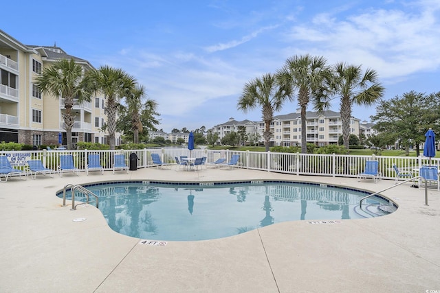 4895 Luster Leaf Cir Unit 302, Myrtle Beach, SC 29577 - community pool featuring a patio area