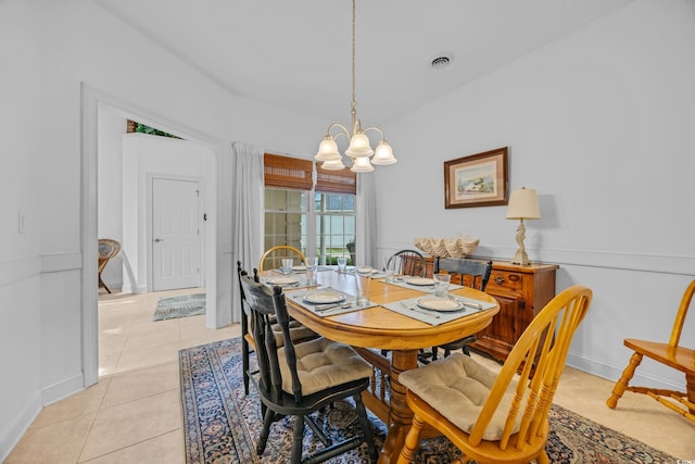 444 Dornoch Dr, Pawleys Island, SC 29585 - dining space featuring a chandelier, light tile patterned floors, and baseboards