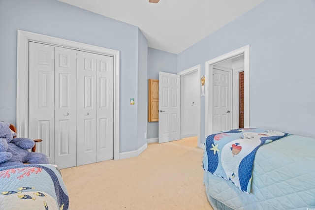 444 Dornoch Dr, Pawleys Island, SC 29585 - bedroom featuring light carpet, a closet, ceiling fan, and baseboards