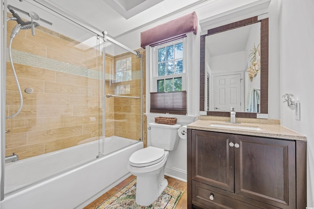 444 Dornoch Dr, Pawleys Island, SC 29585 - bathroom with toilet, bath / shower combo with glass door, vanity, and wood finished floors