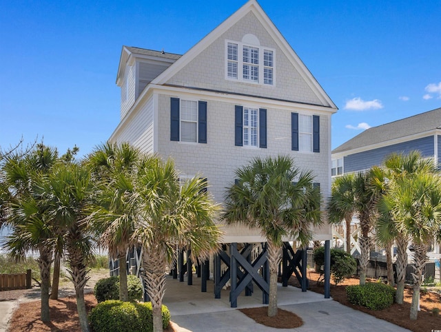 703 S Waccamaw Dr, Garden City Beach, SC 29576 - coastal inspired home with a carport