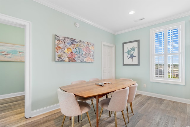703 S Waccamaw Dr, Garden City Beach, SC 29576 - dining area with light wood finished floors, baseboards, crown molding, and recessed lighting