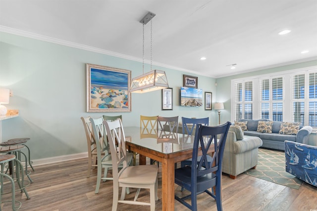 703 S Waccamaw Dr, Garden City Beach, SC 29576 - dining space with wood finished floors, crown molding, baseboards, and recessed lighting