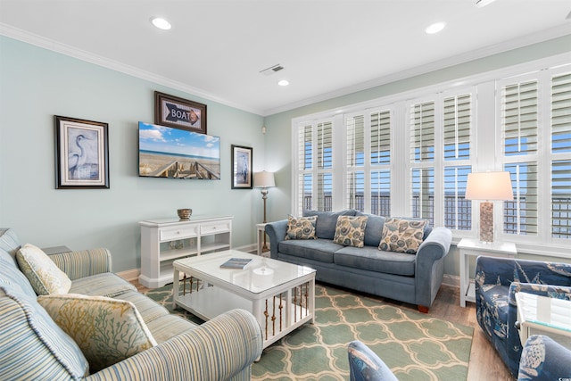 703 S Waccamaw Dr, Garden City Beach, SC 29576 - living room with wood finished floors, baseboards, recessed lighting, ornamental molding, and healthy amount of natural light
