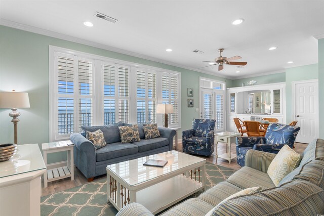 703 S Waccamaw Dr, Garden City Beach, SC 29576 - living room with crown molding, wood finished floors, a ceiling fan, and recessed lighting