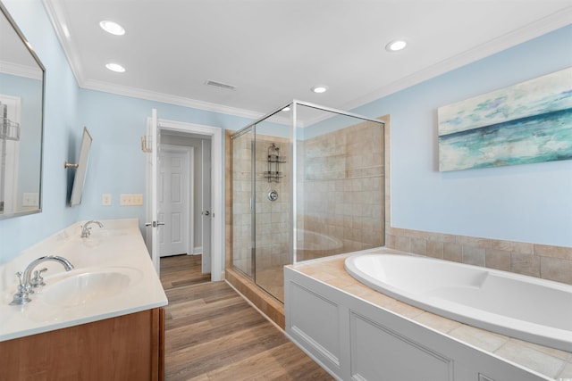 703 S Waccamaw Dr, Garden City Beach, SC 29576 - bathroom with crown molding, a shower stall, a bath, recessed lighting, and double vanity