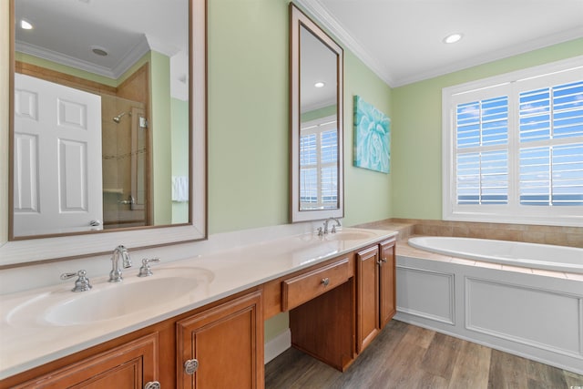 703 S Waccamaw Dr, Garden City Beach, SC 29576 - full bathroom featuring ornamental molding, double vanity, wood finished floors, a bath, and a shower