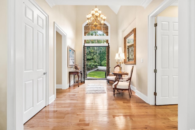 509 Heston Point Dr, Pawleys Island, SC 29585 - entryway with a chandelier, baseboards, and light wood-style floors