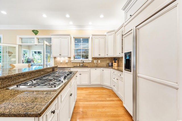 509 Heston Point Dr, Pawleys Island, SC 29585 - kitchen with stainless steel gas stovetop, a sink, paneled built in refrigerator, crown molding, and plenty of natural light