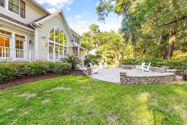 509 Heston Point Dr, Pawleys Island, SC 29585 - view of grassy yard with an outdoor fire pit and a patio