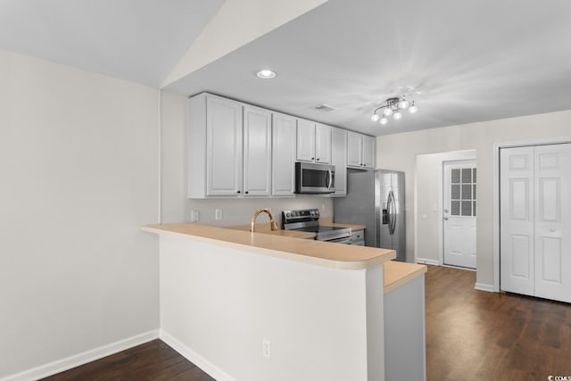 2072 Haystack Way, Myrtle Beach, SC 29579 - kitchen with appliances with stainless steel finishes, baseboards, light countertops, dark wood-type flooring, and a peninsula