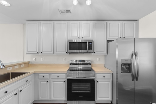 2072 Haystack Way, Myrtle Beach, SC 29579 - kitchen with appliances with stainless steel finishes, a sink, white cabinetry, and light countertops