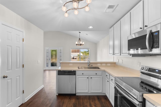 2072 Haystack Way, Myrtle Beach, SC 29579 - kitchen with appliances with stainless steel finishes, a chandelier, a sink, a peninsula, and white cabinets