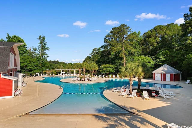 2072 Haystack Way, Myrtle Beach, SC 29579 - community pool featuring a patio area and view of scattered trees