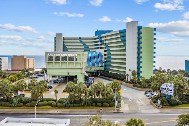 1105 S Ocean Blvd Unit 928, Myrtle Beach, SC 29577 - view of building exterior featuring a water view and uncovered parking