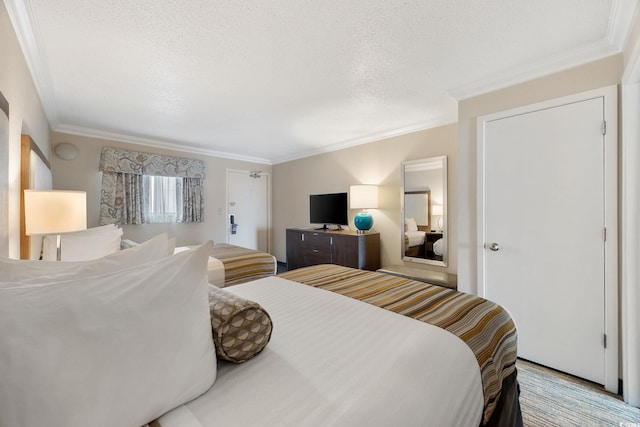 1105 S Ocean Blvd Unit 928, Myrtle Beach, SC 29577 - bedroom featuring crown molding and a textured ceiling