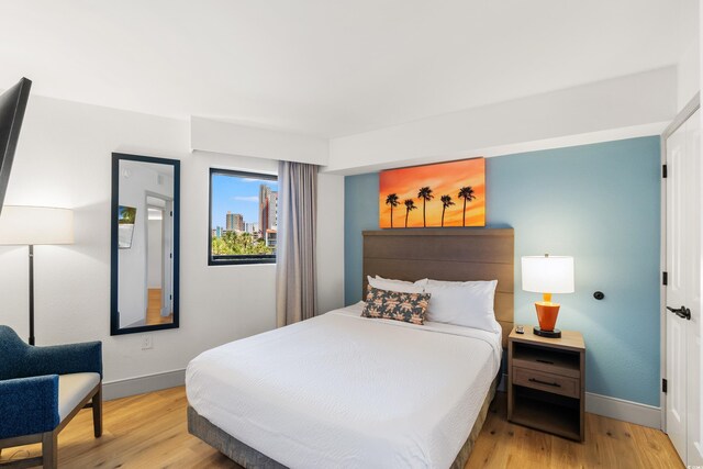 7100 N Ocean Blvd N Unit 321, Myrtle Beach, SC 29572 - bedroom featuring light wood-style flooring and baseboards