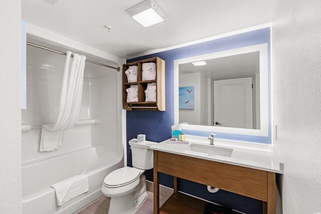 7100 N Ocean Blvd N Unit 321, Myrtle Beach, SC 29572 - bathroom featuring toilet, vanity, washtub / shower combination, wood finished floors, and baseboards