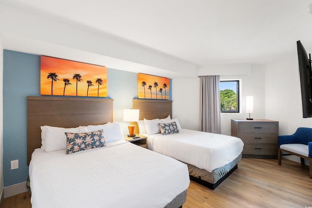 7100 N Ocean Blvd N Unit 321, Myrtle Beach, SC 29572 - bedroom with light wood-style floors and baseboards