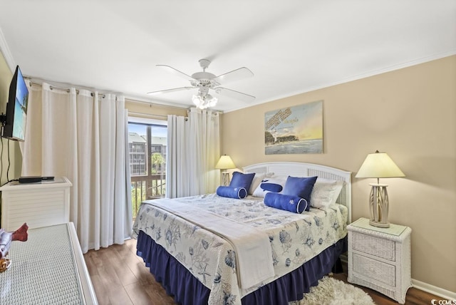 207 N 3rd Ave N Unit 247, North Myrtle Beach, SC 29582 - bedroom featuring wood finished floors, crown molding, access to outside, a ceiling fan, and baseboards